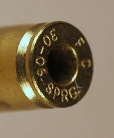Cartridge with drilled primer pocket
