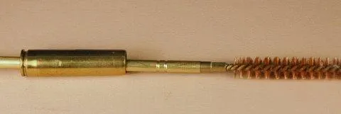 Cleaning rod with cartridge guide and brush